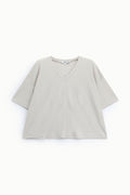 T-shirt femme ample col V en maille brillante, coloris champagne – Please
